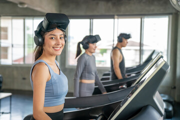 Fototapeta na wymiar Portrait of Healthy Asian sportswoman in sportswear wearing VR glasses jogging exercise on treadmill in virtual reality cyberspace at fitness gym. Metaverse digital entertainment technology and sport.