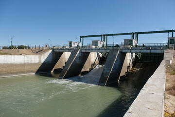 Fototapeta premium Aralsk, Kazakhstan - 10.06.2020 : The territory of the Kokaral dam. Regulation of the water level in the small Aral Sea.
