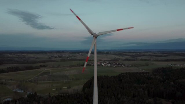 Modern wind turbine with rotor located in rural environment by the Alps in the district Ebersberg in Bavaria. The 10h rule prevents the construction of renewable and sustainable energy. Aerial drone