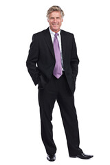 Hes got a big name in the business world. Full length portrait of a businessman standing with his hands in his pockets against a white background.