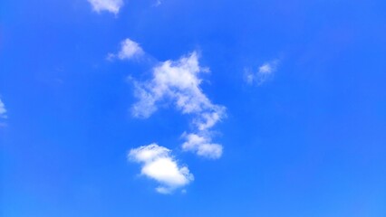 beautiful clear blue sky with few clouds