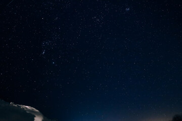 Obraz na płótnie Canvas starry winter dark night sky with lots of stars and constellations