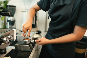 Fototapeta na wymiar Woman barista cafe coffee uniform apron make coffee 
