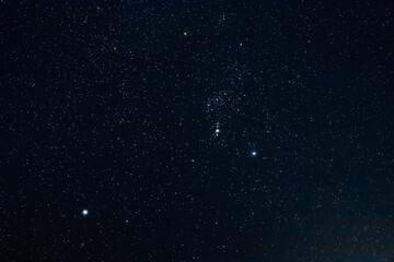 Fototapeta na wymiar starry winter dark night sky with lots of stars and constellations