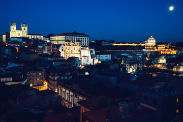 Fototapeta na wymiar View of Porto by night with moon