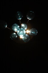 Chandelier of cyan orbs with light