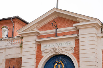Fototapeta na wymiar palais national french text translation means palace prefecture in toulouse city france town center facade building wall