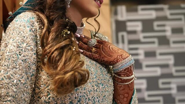 Close up shot of a beautifully decorated Pakistan bride in wedding day. No face video.