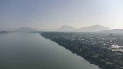 Aerial view of Chiang Khan Old Village during misty morning by drone. Village along the Mekong River are Thai-Laos border, which is now a famous tourist attraction of Loei Province Thailand.