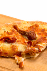 Extreme Closeup View of Sliced Traditional Freshly Baked Cheese and Mushrooms Pizza On Woden Plate. Food Concepts.