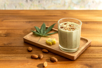Photo of Bhang Lazzi Indian Tea with cannabis serves with almond crumbles and piece of cannabis...