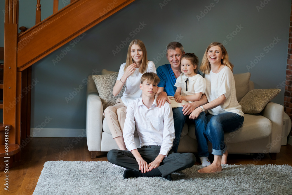 Wall mural big happy family. portrait grandparents, mother father and their two lovely children, sister and bro