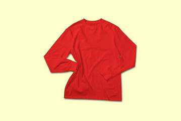 Red long sleeve t shirt top view with creative flat lay concept