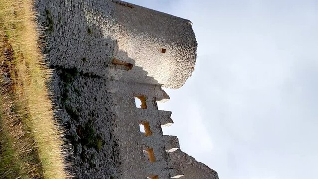 Low angle view of  impregnable Rocca Calascio medieval fortress, Abruzzo. Italy. VERTICAL format