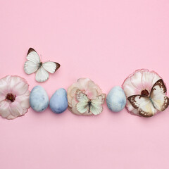 Easter decorations. Spring flowers and eggs on pink background