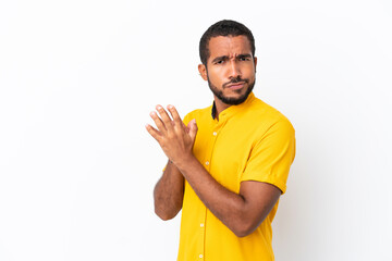 Young Ecuadorian man isolated on white background scheming something