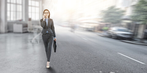Young businesswoman walking towards success
