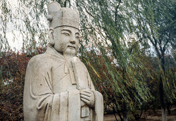 Ornate stone-carved Chinese warrior statues in a park near the Ming Tombs, northwest of Beijing,...