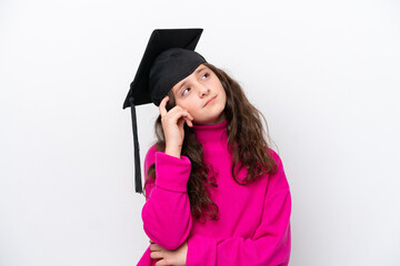 Little student girl wearing a graduated hat isolated on pink background having doubts and with confuse face expression