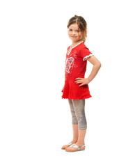 Cute and sassy. Cute little girl standing against a white background.
