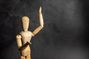 wooden figure of a person, giving speech