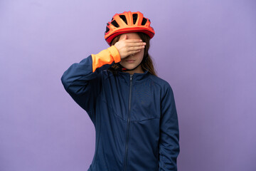 Little caucasian girl isolated on purple background covering eyes by hands. Do not want to see something