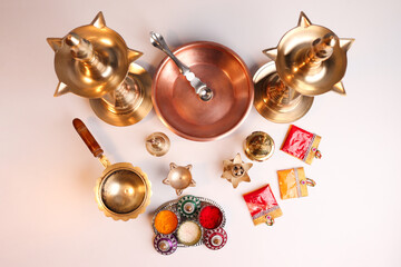Indian traditional samai or samayee brass lamp, puja thali with includig kalash agarbatti
diya dhup samai agarbatti holder kunku sindoor or Kumkum turmeric haldi or halad on white background - obrazy, fototapety, plakaty