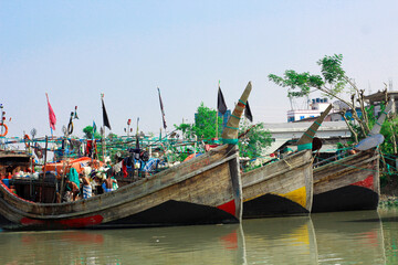Fototapeta na wymiar 14-Jan-2020 Barguna,Bangladesh. The wooden fishing boats are arranged in rows