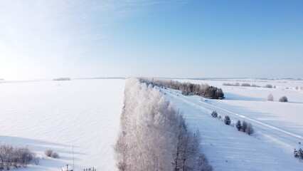 Obraz premium shooting from a drone in winter forests and fields