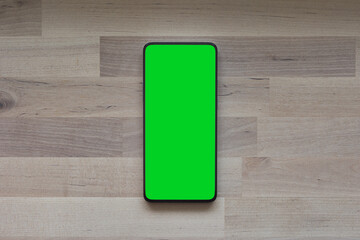 Mobile phone tablet with round edges, with blank green screen