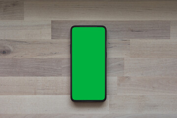 Mobile phone tablet with round edges, with blank green screen