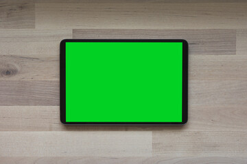 Mobile phone tablet with round edges, with blank green screen