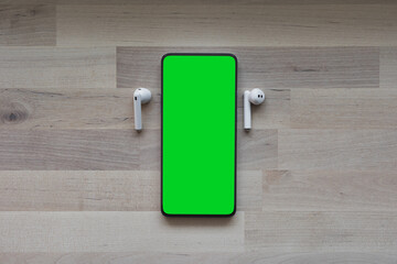 Mobile phone tablet with round edges, with blank green screen