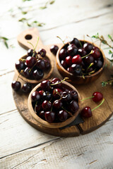 Fresh cherry served in wooden bowls