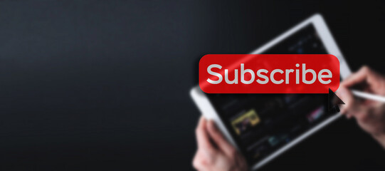 Subscribe button. Online video subscription red button. Internet service on laptop digital tablet blured banner background. Visual contents concept. Social networking service.