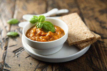 Homemade roasted vegetables dip with fresh basil