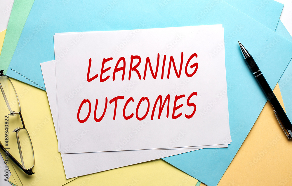 Poster learning outcomes text on paper on colorful paper background