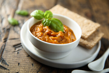 Homemade roasted vegetables dip with fresh basil