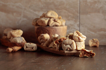 Dried figs in a wooden dish.