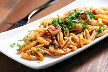 Malloreddus al ragu, pasta tradizionale sarda, Cibo Italiano 