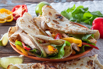 Chicken fajitas. American and mexican cuisine. Fajitas with pepper and chicken