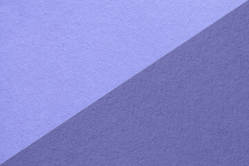 Texture of blue paper background, half two colors, macro. Very peri color of the year 2022.