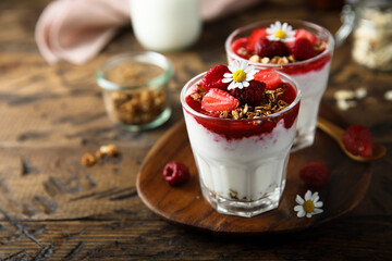 Yogurt dessert with granola and berries