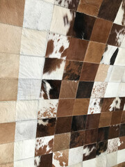 Decorate the headboard wall with leather patchwork.