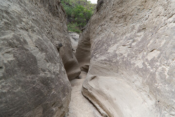 The narrow walls of the Los Hoyos trail in the gray desert of Tatacoa, Colombia