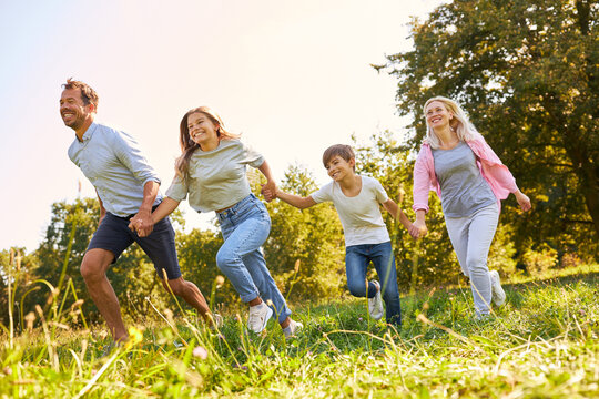 Happy family with two children running