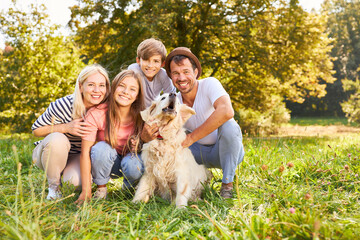 Obraz premium Happy family with two children and dog