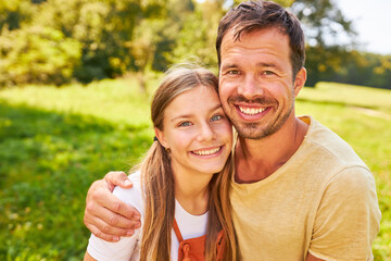 Fototapeta premium Proud and happy father hugs his daughter