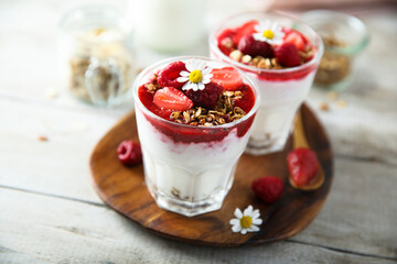 Yogurt dessert with granola and berries