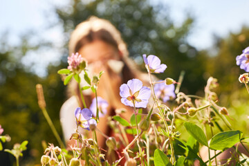 Blooming flowers and child with hay fever - obrazy, fototapety, plakaty